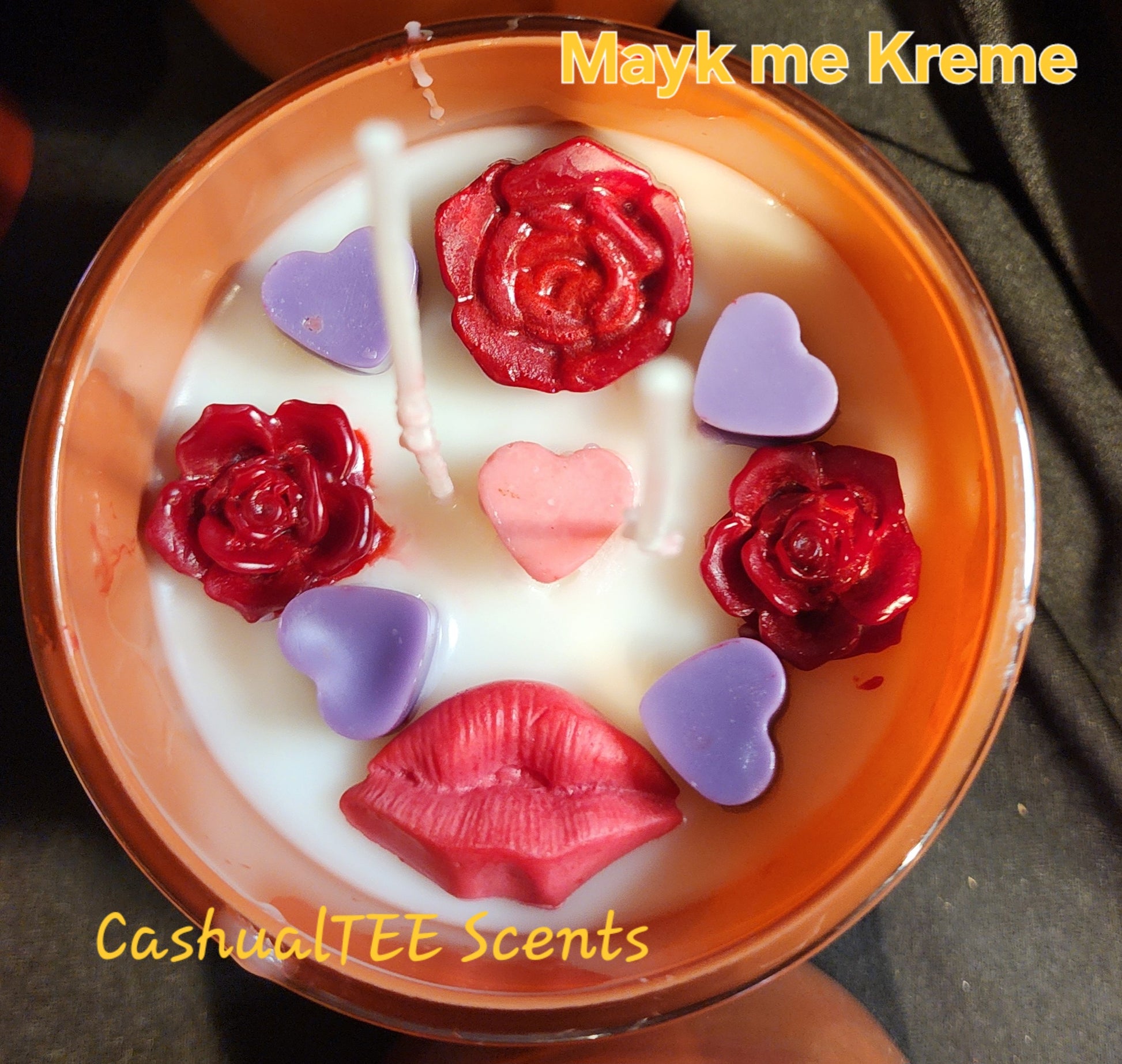 A TEM WITH A LABEL THAT SAYS MAYK ME KREME-FLORAL_STRAWBERRIES_CREAM