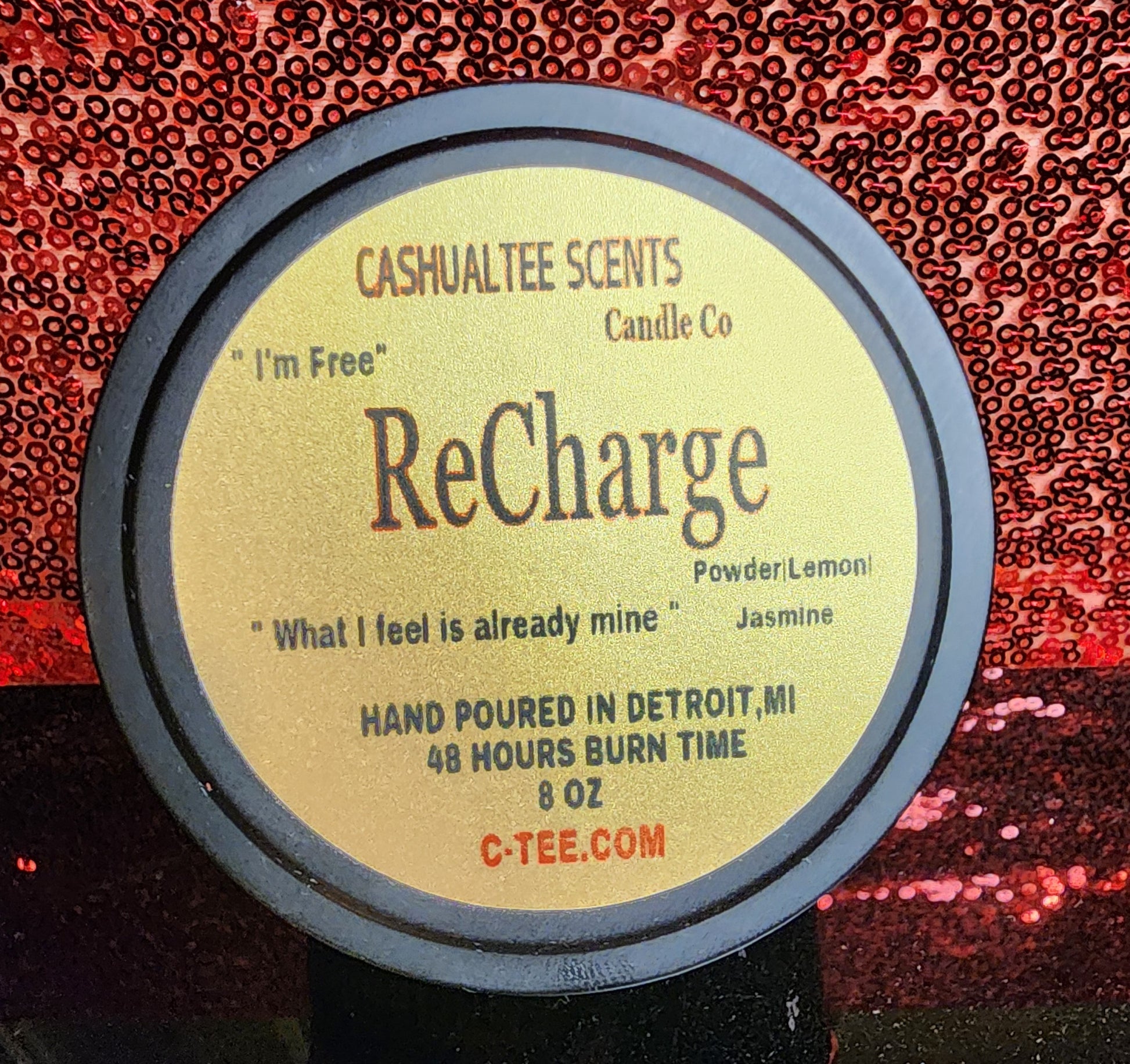 A item with a label that says RECHARGE Wood Wick Candle – Baby Powder & Lemongrass