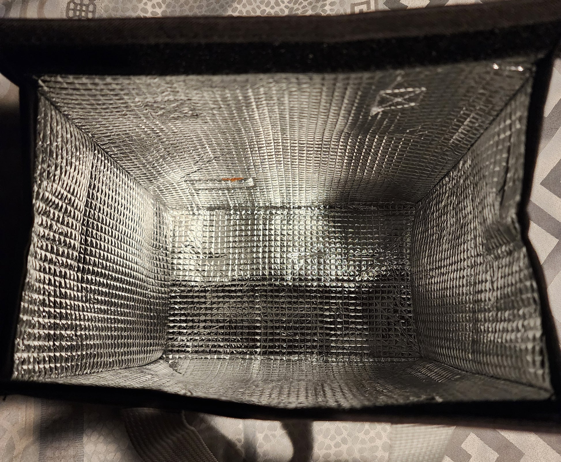 A BAG WITH A LABEL THAT SAYS TONY RONEY SMOKES TRAVEL BAG