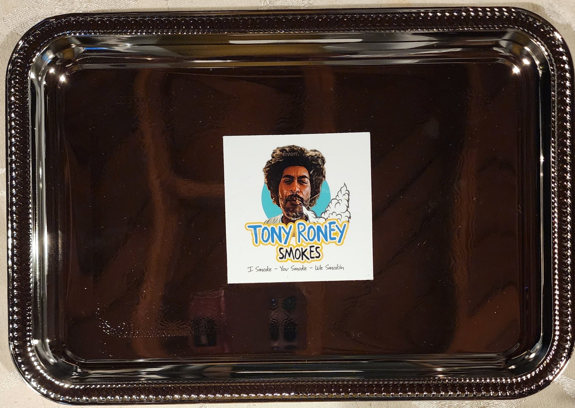 A TRAY WITH A LABEL THAT SAYS TONY RONEY SMOKES TRAY