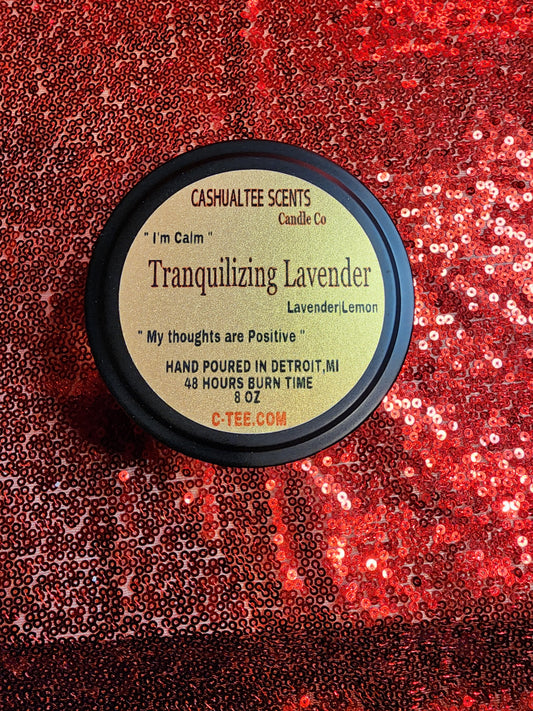A candle with a label that says TRANQUILIZING LAVENDER WOOD WICK CANDLE – Lavender and Lemons.