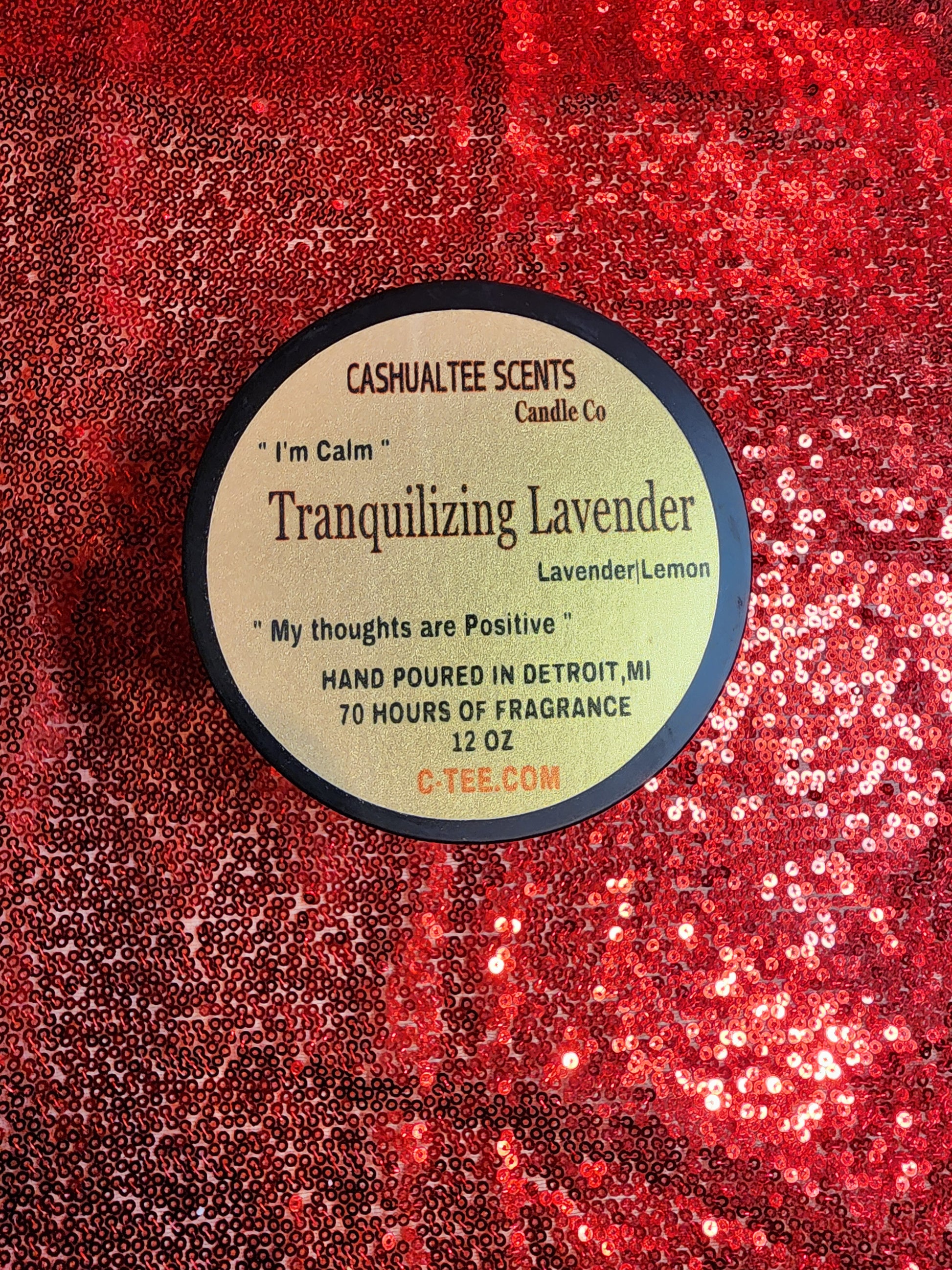 A candle with a label that says TRANQUILIZING_LAVENDER_lavender_lemon