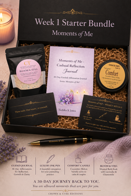 A curated self-care gift set labeled 'Week 1 Starter Bundle Moments of Me' arranged in an open black box. Visible items include a guided journal, a reflection journal, a candle, a comfort candle, a pen, and cards, with a lit candle and lavender sprigs around the box.