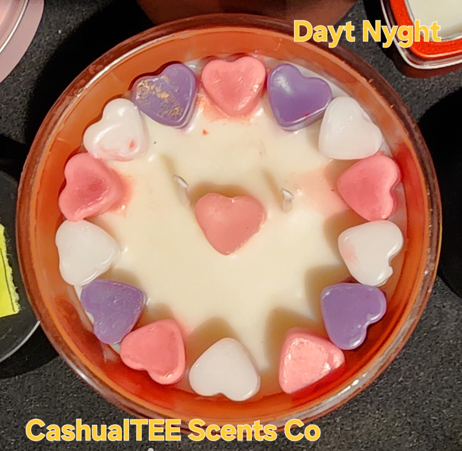 A candle with a label that says day tnyght Lavender_ Lemons_ Love 
